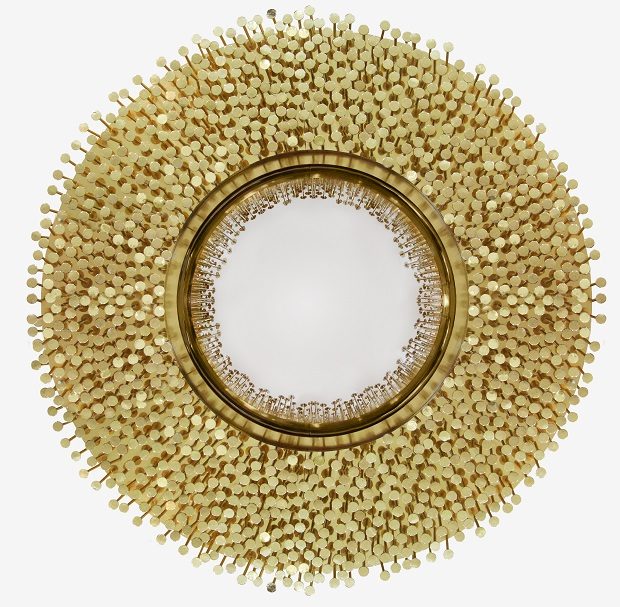 From the legend born in the depths of Sherwood Forest, ROBIN Mirror  embodies the strength and character of noble ages, giving them a modern approach. By honoring the history of one of the best archers in English literature, this exquisite piece was given a strong visual texture through the use of handmade nails, each one unique in their finishing, size and character. The fish-eye mirror is supported by a brass structure that turns ROBIN into one of the most emblematic pieces of the entire collection.